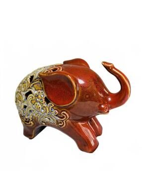 Decorative Ceramic Elephant Figurine with Intricate Cutout Design